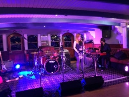A function band aboard a London Thames cruise.